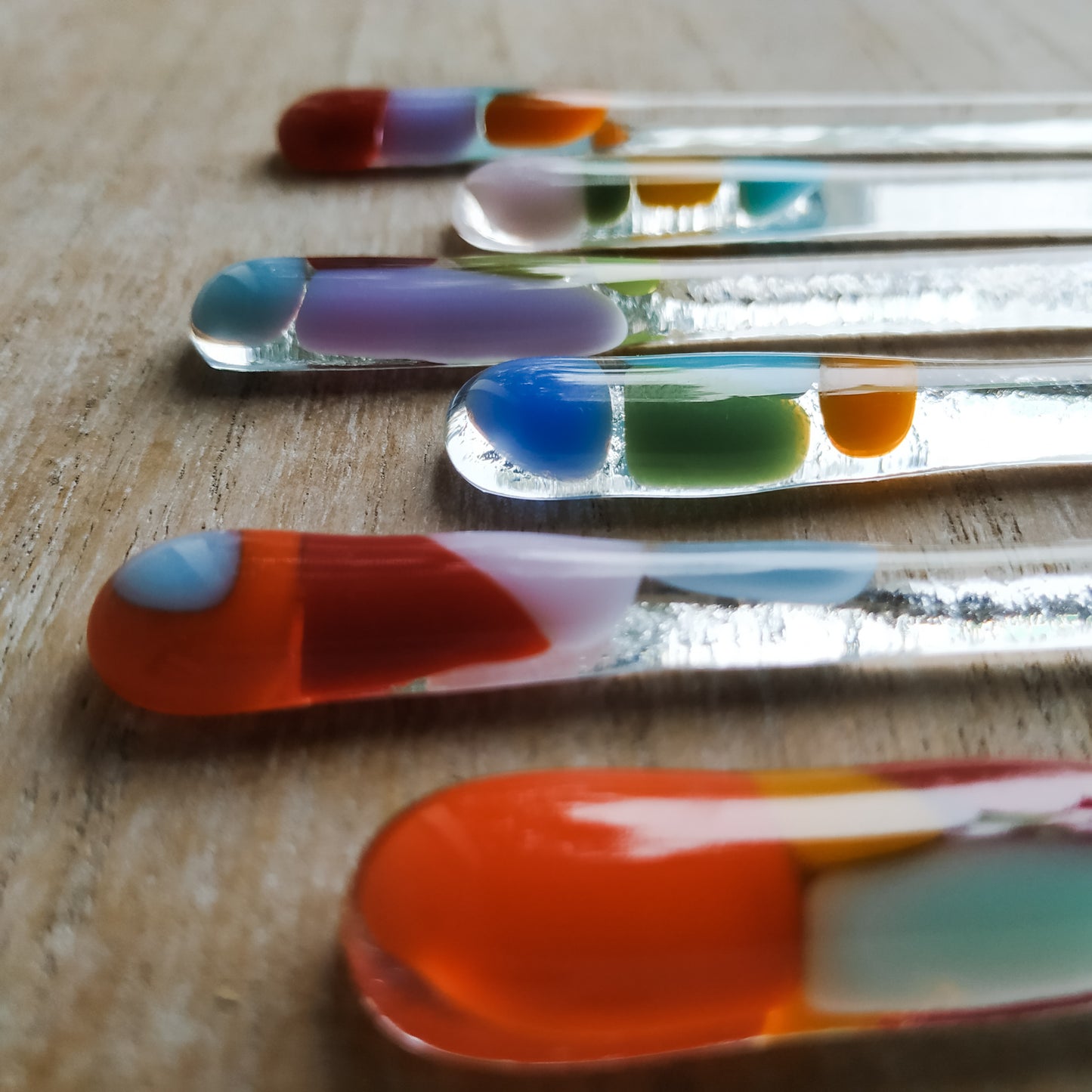 Colourful glass swizzle sticks by Pamela Angus